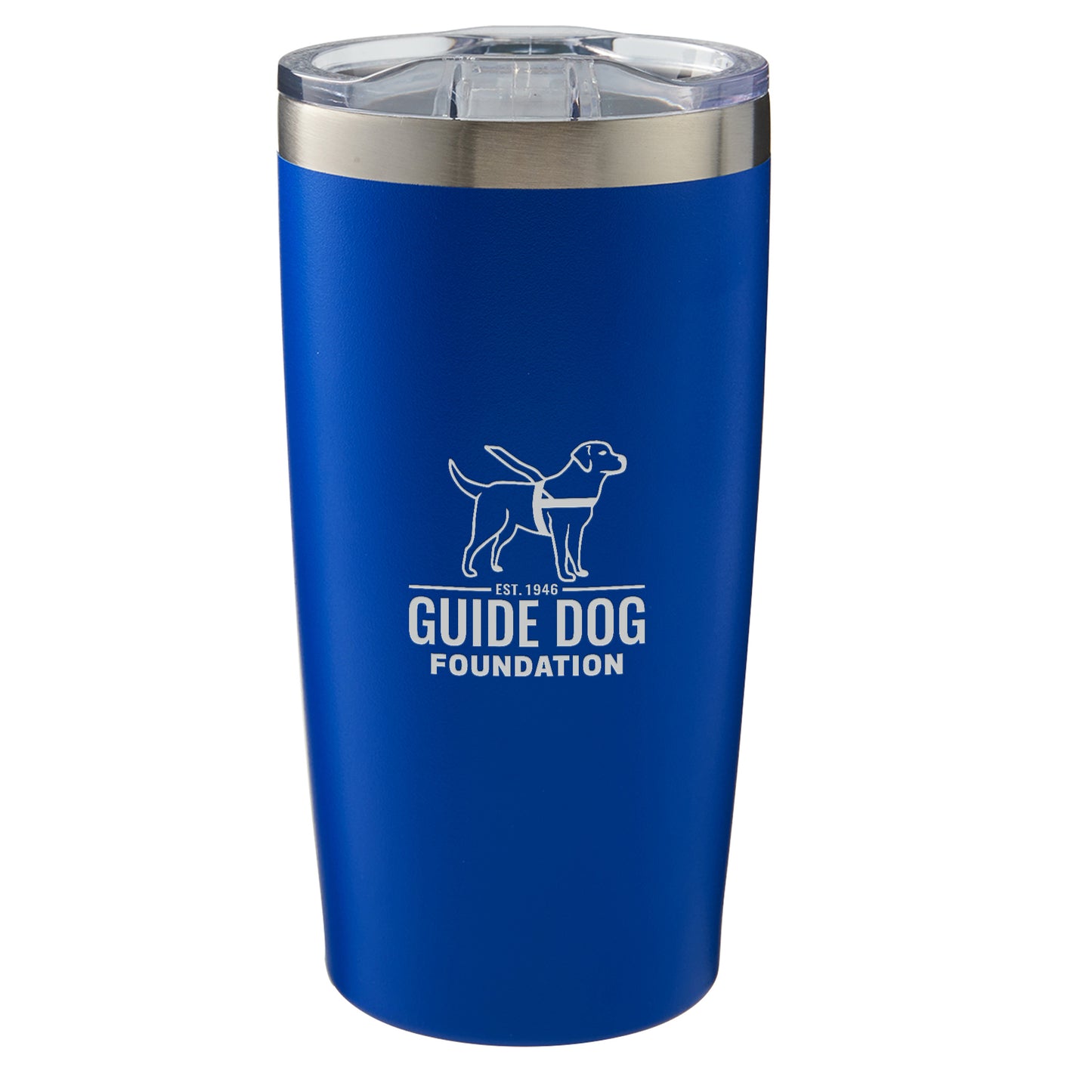 This image features a blue 20 oz travel mug with a silver rim at the top and a clear plastic lid. The front of the mug displays the Guide Dog Foundation logo in white. The logo includes an outline of a guide dog in harness standing above the organization's name, "GUIDE DOG FOUNDATION," with "Est. 1946" written below the dog image.