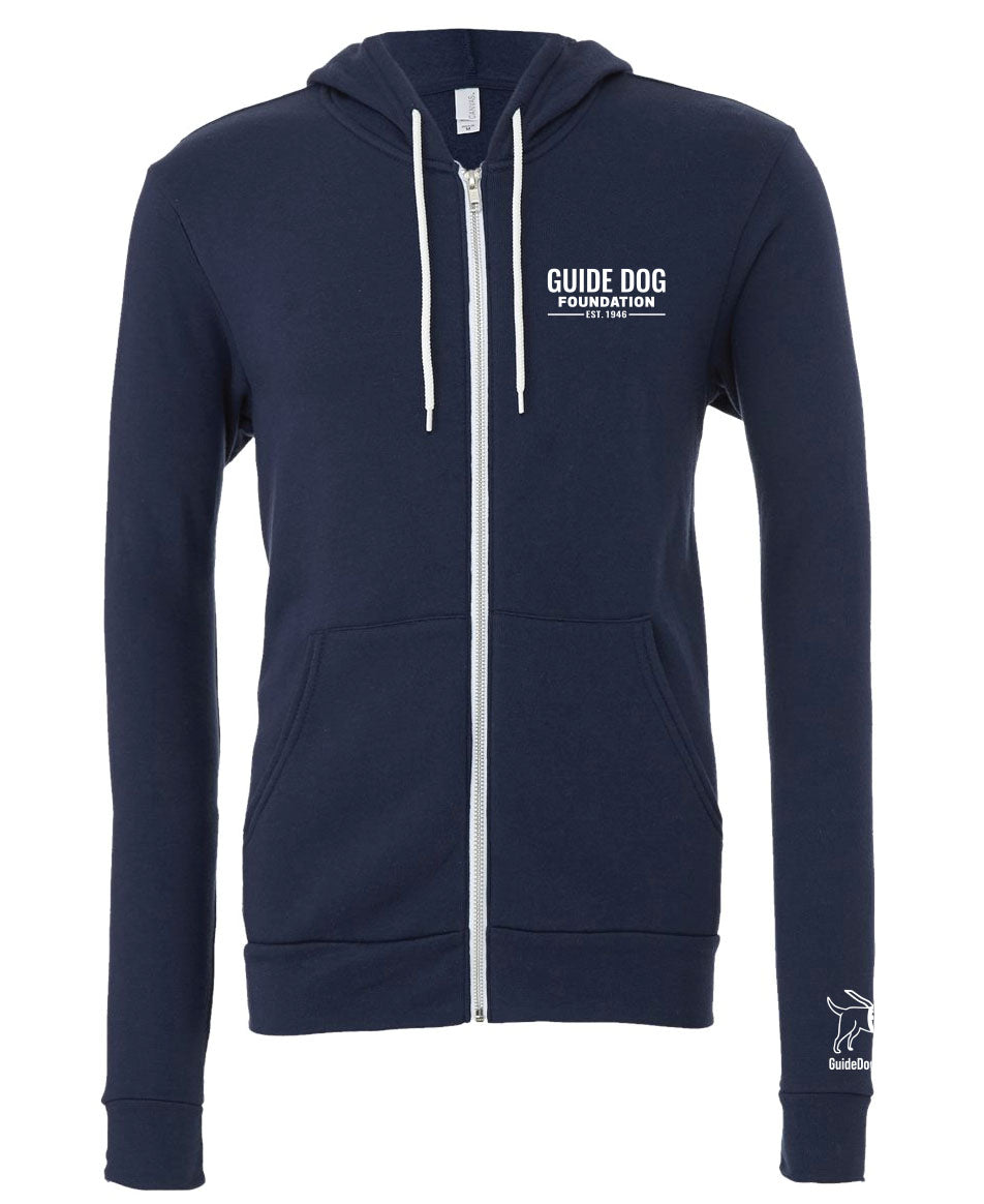 Image description: A soft, navy zip-up sweatshirt with a white zipper running down the front. The sweatshirt has white drawstrings for the hood and features the white Guide Dog Foundation logo on the left chest. Additionally, the Guide Dog Foundation logo, depicting a guide dog, is present on the left sleeve, accompanied by the "GuideDog.org" URL written underneath in a clear, legible font.