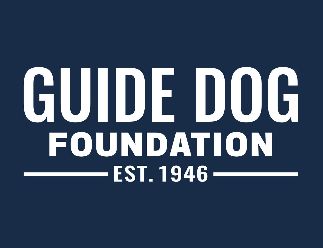 Close up of a white Guide Dog Foundation logo dog with the white "GuideDog.org" on a navy background.