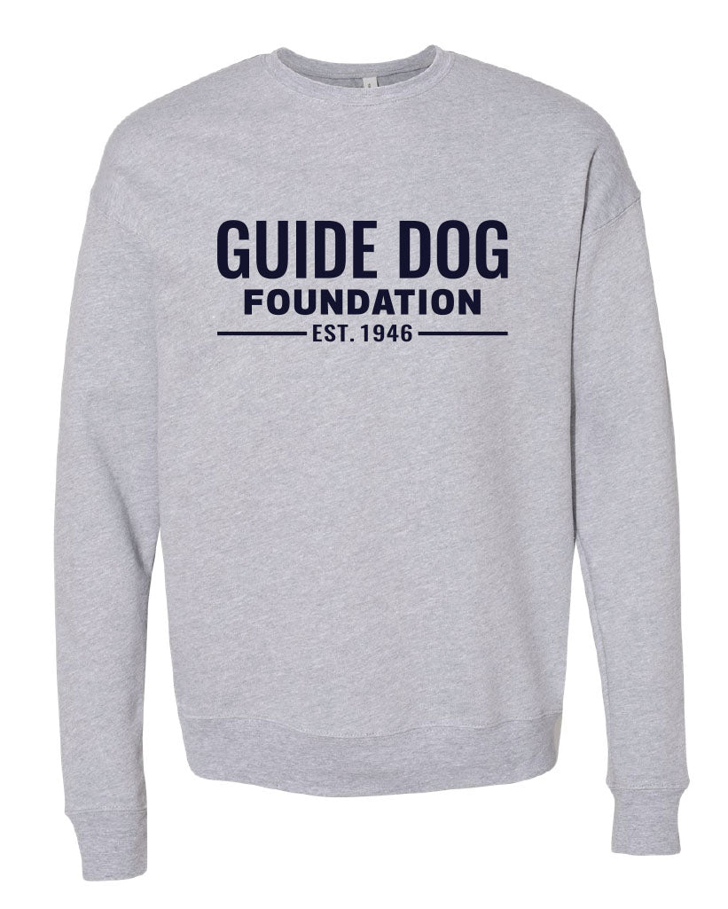 Long sleeve grey crewneck sweatshirt with navy "Guide Dog Foundation" logo across the chest with "EST. 1946" underneath.