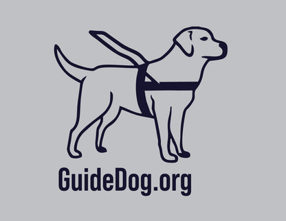 Close up of a navy Guide Dog Foundation logo dog with the navy "GuideDog.org" on a grey background.