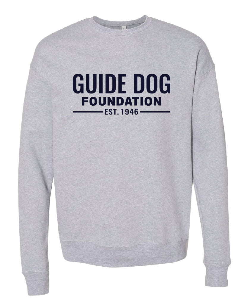 Long sleeve grey crewneck sweatshirt with navy "Guide Dog Foundation" logo across the chest  with "EST. 1946" underneath. 